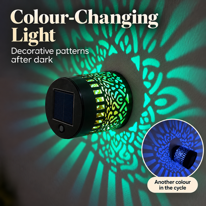 Colour-changing solar light mounted to the wall by its bottom base